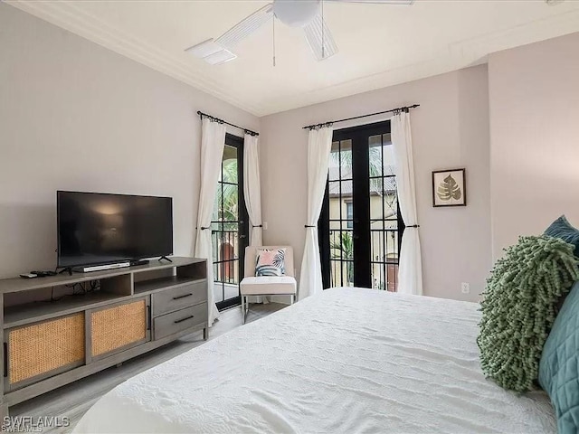 bedroom featuring wood finished floors, a ceiling fan, and access to exterior