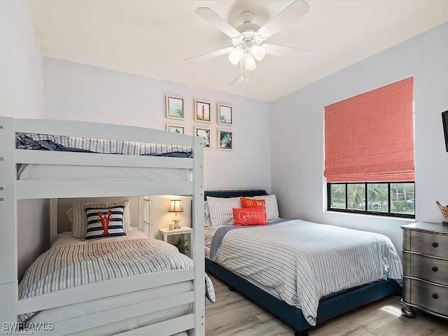 bedroom featuring ceiling fan and wood finished floors