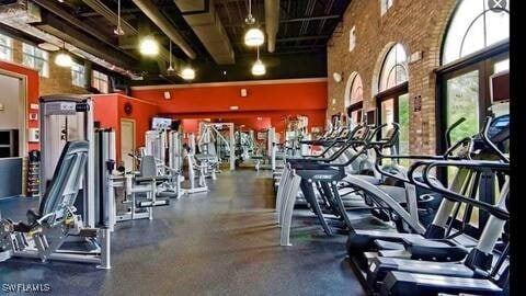 exercise room with a towering ceiling