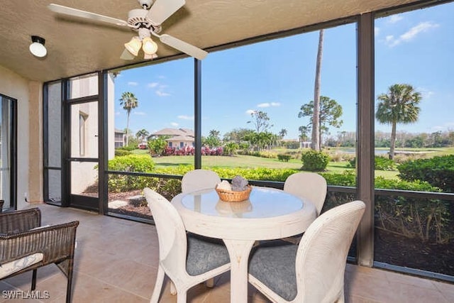 sunroom / solarium with ceiling fan