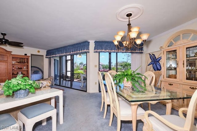 dining room with carpet, crown molding, and ceiling fan with notable chandelier