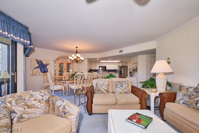 carpeted living area with visible vents, a chandelier, and ornamental molding