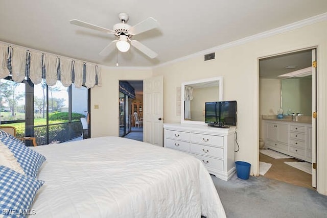 carpeted bedroom featuring ensuite bathroom, access to outside, ornamental molding, and visible vents