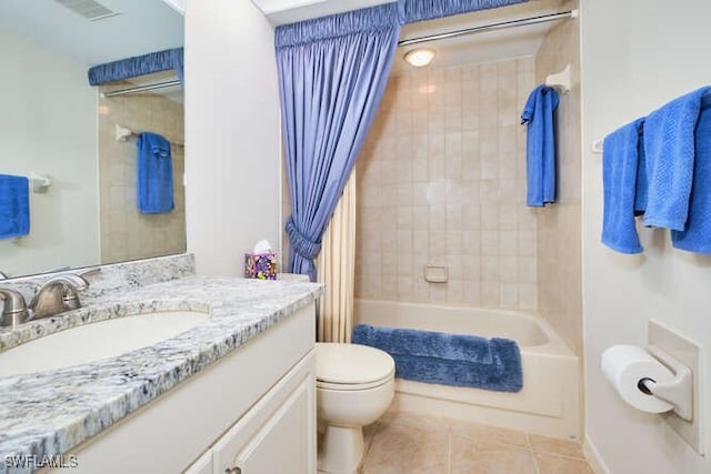 bathroom featuring visible vents, toilet, shower / bath combo, vanity, and tile patterned floors