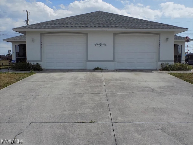 garage with driveway