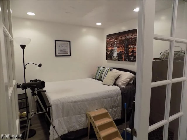 bedroom featuring dark wood finished floors and recessed lighting