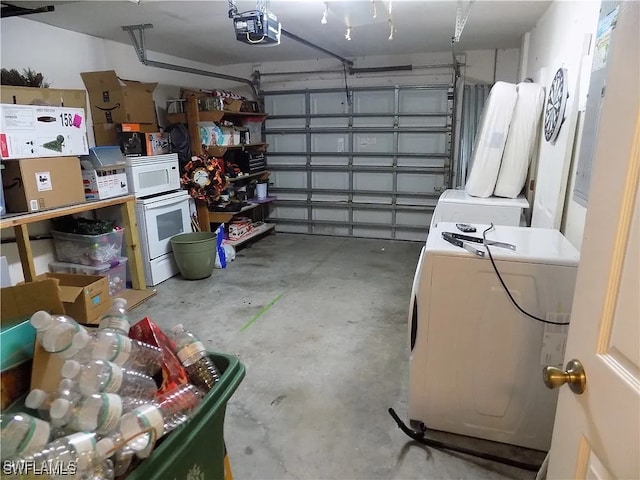 garage with washer / clothes dryer and a garage door opener