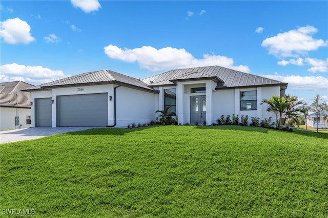 view of front of house with an attached garage, a standing seam roof, metal roof, and stucco siding