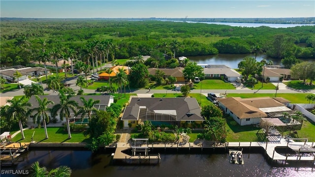 bird's eye view with a water view, a residential view, and a view of trees