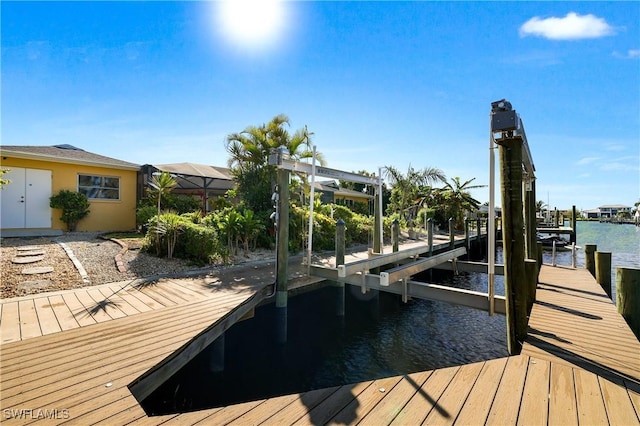 view of dock featuring a water view and boat lift