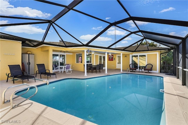 pool with a lanai and a patio