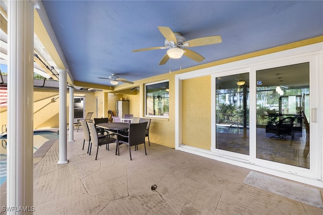 sunroom with a ceiling fan