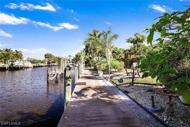 view of dock featuring a water view and boat lift