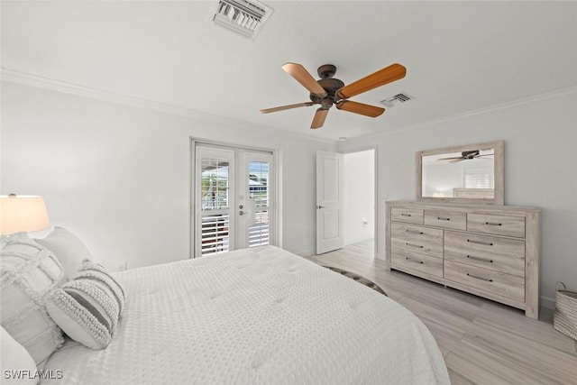 bedroom featuring light wood-type flooring, access to outside, visible vents, and ornamental molding