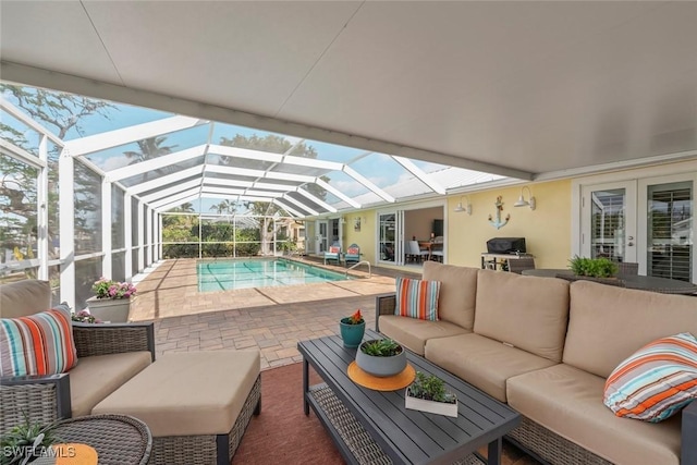 exterior space with french doors, glass enclosure, an outdoor pool, and an outdoor living space