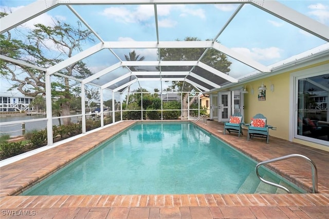 pool featuring a lanai and a patio