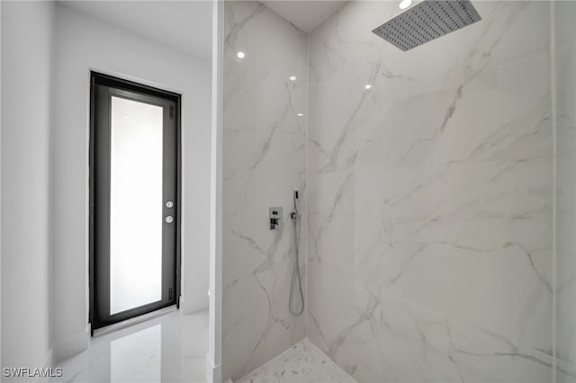 full bath with a marble finish shower