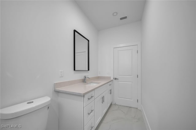 bathroom with marble finish floor, visible vents, toilet, vanity, and baseboards