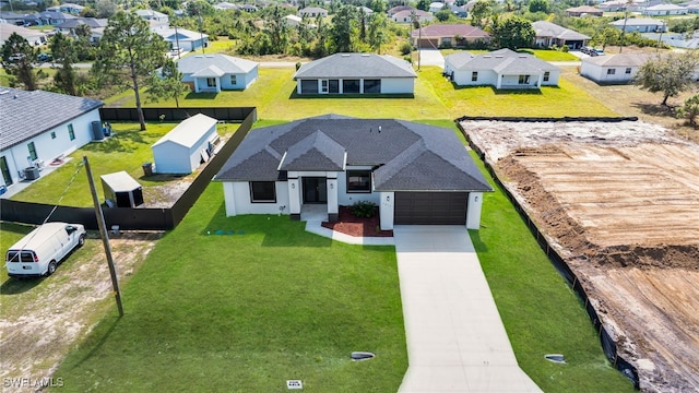 birds eye view of property with a residential view