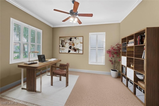 carpeted office space with ornamental molding, baseboards, and a ceiling fan