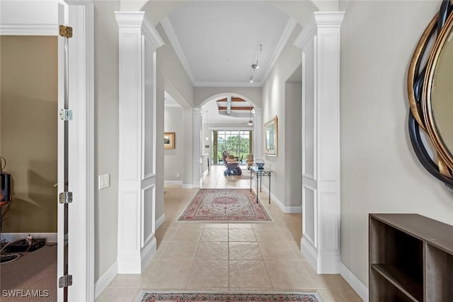 18191 Parkside Greens Dr, Fort Myers, FL 33908 - hall featuring ornate columns, arched walkways, light tile patterned floors, and crown molding