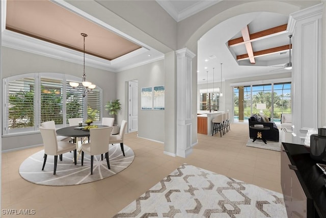 dining space with ornate columns, ornamental molding, light tile patterned flooring, baseboards, and ceiling fan with notable chandelier