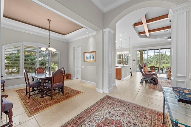 dining area featuring baseboards, crown molding, ornate columns, and light tile patterned floors