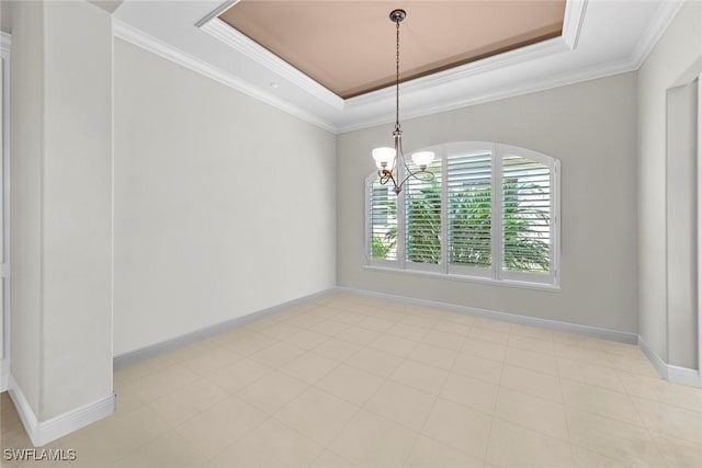 empty room featuring a notable chandelier, baseboards, a raised ceiling, and crown molding