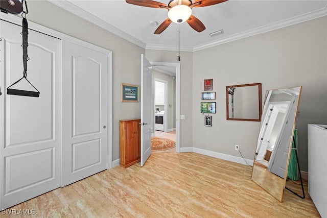 18191 Parkside Greens Dr, Fort Myers, FL 33908 - unfurnished bedroom with baseboards, light wood-style floors, crown molding, ceiling fan, and a closet