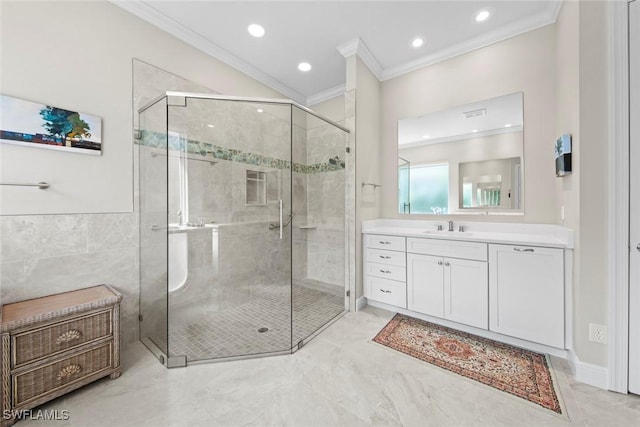 bathroom featuring ornamental molding, recessed lighting, a shower stall, and vanity