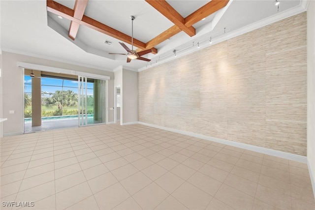 interior space with a ceiling fan, coffered ceiling, beam ceiling, and baseboards