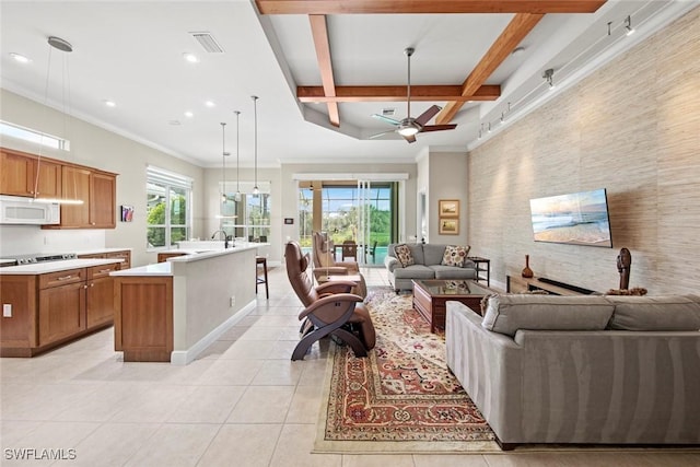 18191 Parkside Greens Dr, Fort Myers, FL 33908 - living area featuring an accent wall, light tile patterned floors, baseboards, a ceiling fan, and coffered ceiling