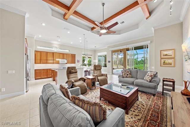 living area featuring visible vents, beamed ceiling, baseboards, and light tile patterned floors