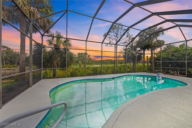 18191 Parkside Greens Dr, Fort Myers, FL 33908 - pool at dusk with an outdoor pool, a patio area, and glass enclosure