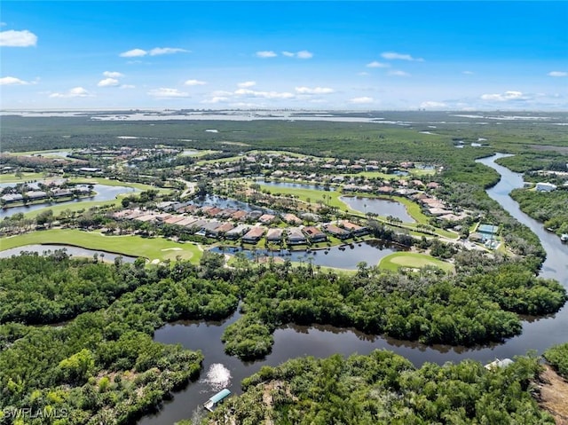 drone / aerial view featuring view of golf course and a water view