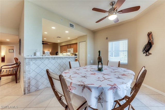 dining area with light tile patterned floors, visible vents, baseboards, ceiling fan, and recessed lighting