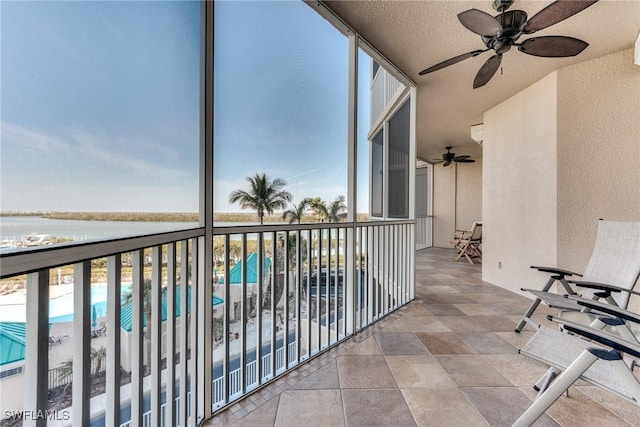 balcony featuring a ceiling fan