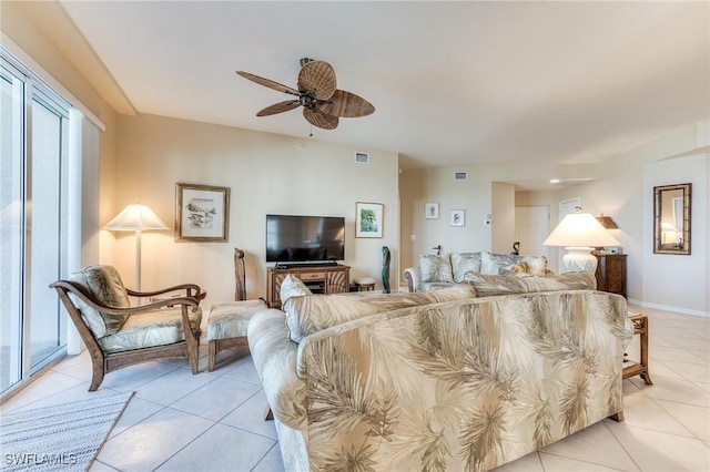 bedroom with baseboards, visible vents, a ceiling fan, and light tile patterned flooring