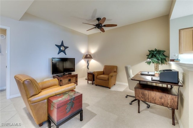 living area with ceiling fan, baseboards, and light colored carpet