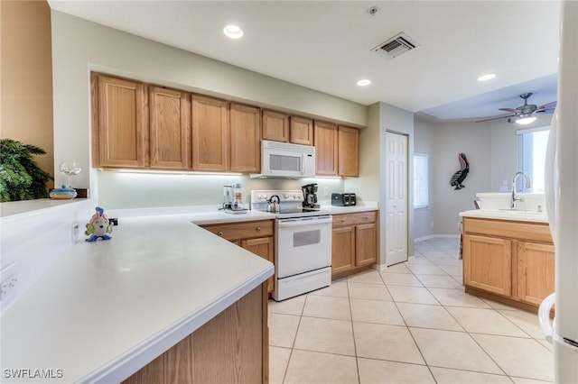 kitchen with white appliances, light tile patterned floors, visible vents, light countertops, and recessed lighting