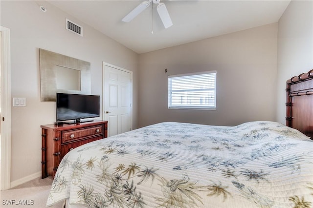 bedroom featuring light carpet, baseboards, visible vents, lofted ceiling, and ceiling fan