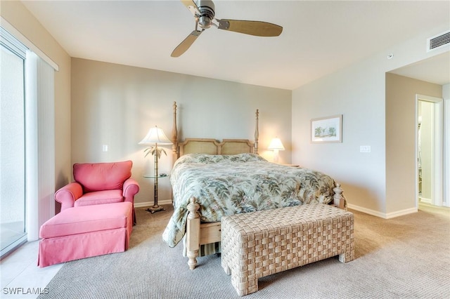 carpeted bedroom featuring ceiling fan, visible vents, and baseboards