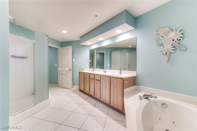 bathroom featuring a shower stall, a tub with jets, a sink, and tile patterned floors