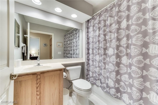 full bathroom with vanity, toilet, and recessed lighting