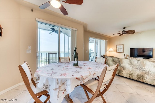 dining area featuring baseboards and light tile patterned floors