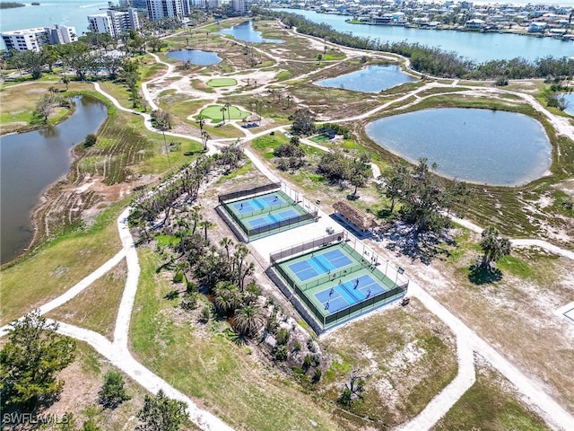 birds eye view of property with a view of city and a water view