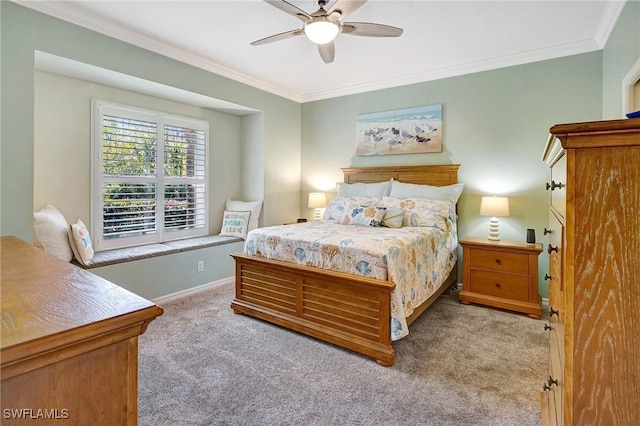 bedroom with crown molding, baseboards, ceiling fan, and carpet flooring