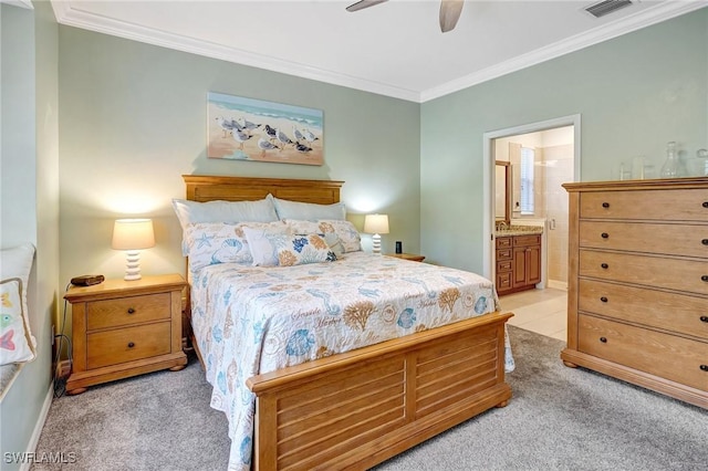 bedroom featuring crown molding, visible vents, light carpet, connected bathroom, and ceiling fan