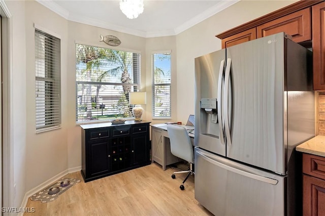 home office featuring ornamental molding, light wood-type flooring, and baseboards