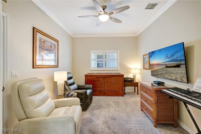 sitting room with visible vents, crown molding, light carpet, and ceiling fan